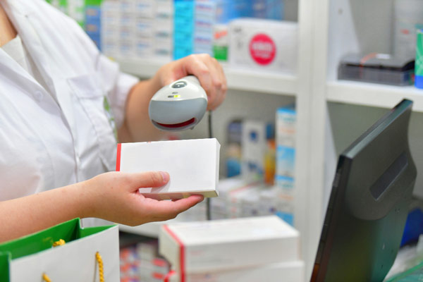 Woman scanning a white box for purchase